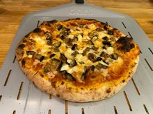 Another practice pizza (this time feta and eggplant) on the gas pizza oven. Still getting a hang of the flame control, but consistency is improving.