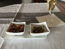 Brought out shortly after wheels up. The FAs were cognizant that folks wanted to sleep, but the service didn’t feel rushed. 

The new champagne (a blanc de blanc) is pretty good and a step up from the Charles de Cazanove. Not on par with the Palmes d’Or that was randomly served last year (out of a plastic cup) or LPGS, but it’s good. 