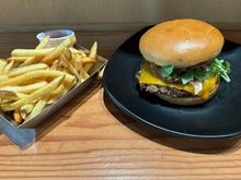 Kenji burger - Teriyaki, ponzu aioli, caramelized onions, cheddar, arugula and tomato 