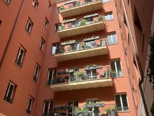 Courtyard view of rooms with a balcony