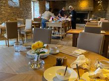 Cleaning up breakfast at Domaine des Etangs in the restaurant with a small but high quality buffet.