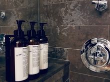 Full size Le Labo in the shower/tub “room”