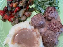 Marcus Samuelsson’s Swedish meatballs, sauce and pickled cucumbers recipes with mashed potatoes and mixed vegetables. 