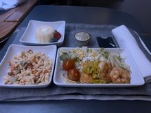 Pre-arrival meal. Effectively a shrimp salad with a side of orzo. It was sufficient, but not on par with a hot pre-arrival F meal you’d have on the London route (for example). 