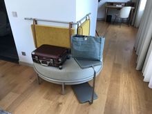 Corner stool used for suitcase placement.