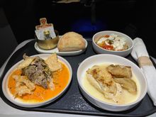 Warm bread, bulgar salad, roast chicken, and pork shoulder.