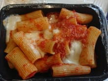 Rigatoni pasta with tomato sauce,mozzarella and grana padano cheese 