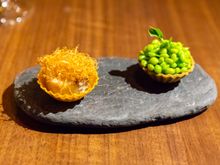 Amuse bouche: On the right, a cheese cream, peas, and pastry shell. On the left, a konbun kelp pastry shell with fish cream and mushroom. 