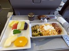 ATH-AMS breakfast: Scrambled eggs.  Tasted good.  The small cake like cookie seems to be a Greek festive thing, I don't know what's it is called.  Was also available in the lounge.