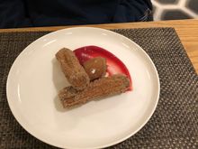 Cinnamon churros with chocolate cream and blood orange gel