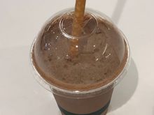 Dark chocolate sorbet almond milkshake with whole meal edible straw 