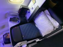 Seat 1A- here you can see the lowered aisle armrest that can provide a bit more room during lie-flat mode