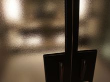This frosted glass effect on the bathroom double doors was really refined.