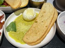 Poached egg with green tomato salsa verde, parmigiano, crostini 

