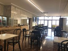 Main lounge dining area, with more seating at front near windows, which have limited apron views. 