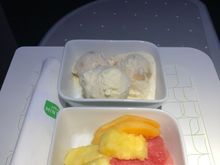 Banana ice cream and vanilla ice cream.  Fresh fruit