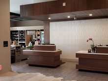 Checkin desk and pantry, with main entrance to the left, and elevators to the right