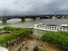 View out of the window overlooking the Rhine, with some sort of wine drinking thing in the back courtyard 