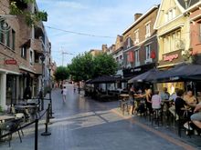 The main street in Genk, full of cafés and restaurants 