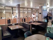 Rather pleasant bar area in the Crowne Plaza with reception in the background 
