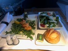 The 'small plate' (poached shrimp remoulade with arugula) and salad (baby spinach and arugula salad) were served together. I'm not big particularly fond of shrimp, so this went untouched. However, the salad was delicious and fresh. The flight attendant also came around with a small selection of rolls. I picked sourdough,  which was served warm. 