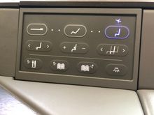 The seat console was pretty self-explanatory and I didn't have to ask for instructions to use it; I used the right-center button the most to move myself closer to the tray table (which was in a fixed position) for the meal service.