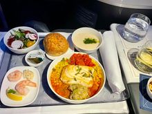 Everything was served at once due to delayed start because of turbulence. Fish was bland but overall edible  