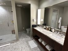 Bathroom angle 1. Spacious though some details missed, such as lack of a movable mirror.