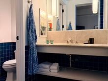 Adjacent bathroom, open to the bedroom
