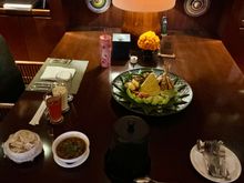 Nasi Kuning / yellow rice “ mountain / volcano “ with sup buntut /oxtail soup and array of dishes
