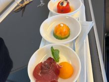 Canapes - bresaola with melon, smoked salmon with cream cheese and cucumber, fire roasted red pepper roulade with goat’s cheese