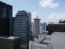 JW Marriott Tang  Plaza ( tiled roof) from the Hilton pool deck
