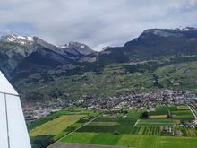 View over Conthey and Vétroz after take-off from Sion airport 