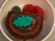 Festive Yule log dessert. Looks better than it tastes. Fruit is nice! 