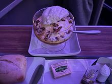 Sundae was brought out with the salad / main. I was able to be in lie-flat mode before folks had wrapped starters. 