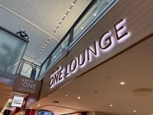 Arrival connecting passenger entry. Gold cart drops and picks up in front of the sign.  