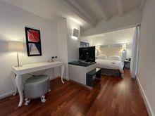 The second floor has a cozy bedroom.