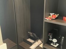 Walk in wardrobe and mini bar (behind bed)