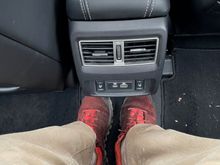 Rear Seat Leg Room --  near flat bottom and not a l ot of cars allow me to put my legs in this position in the middle seat (I am 6ft)