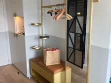 Left of entrance is an open wardrobe