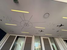 Airbus-themed artwork on the ceiling.