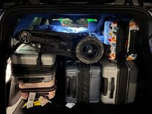 Two large check bags, three carry on bags and a stroller capacity in the trunk (aka boot)
