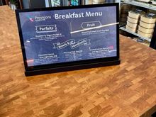Breakfast menu.  There's an attendant to grab boxes and drinks for you.