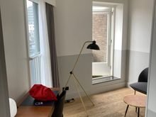 The living area has the desk and door to the terrace