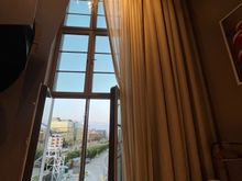 Giant windows with only partially light blocking blinds