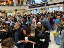 Huge crowd gathers trying to comprehend the (lack of) process being used for boarding