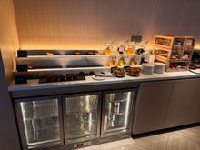 artful croissants over the denuded drink fridge