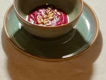 Amuse bouché - beetroot soup with pine nuts 