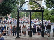 Event was on College Square, across from the iconic UGA arch. At first the crowds were mostly along Broad Street, showing signs to the honking passing cars.