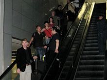 The group on a escalator at SFO.